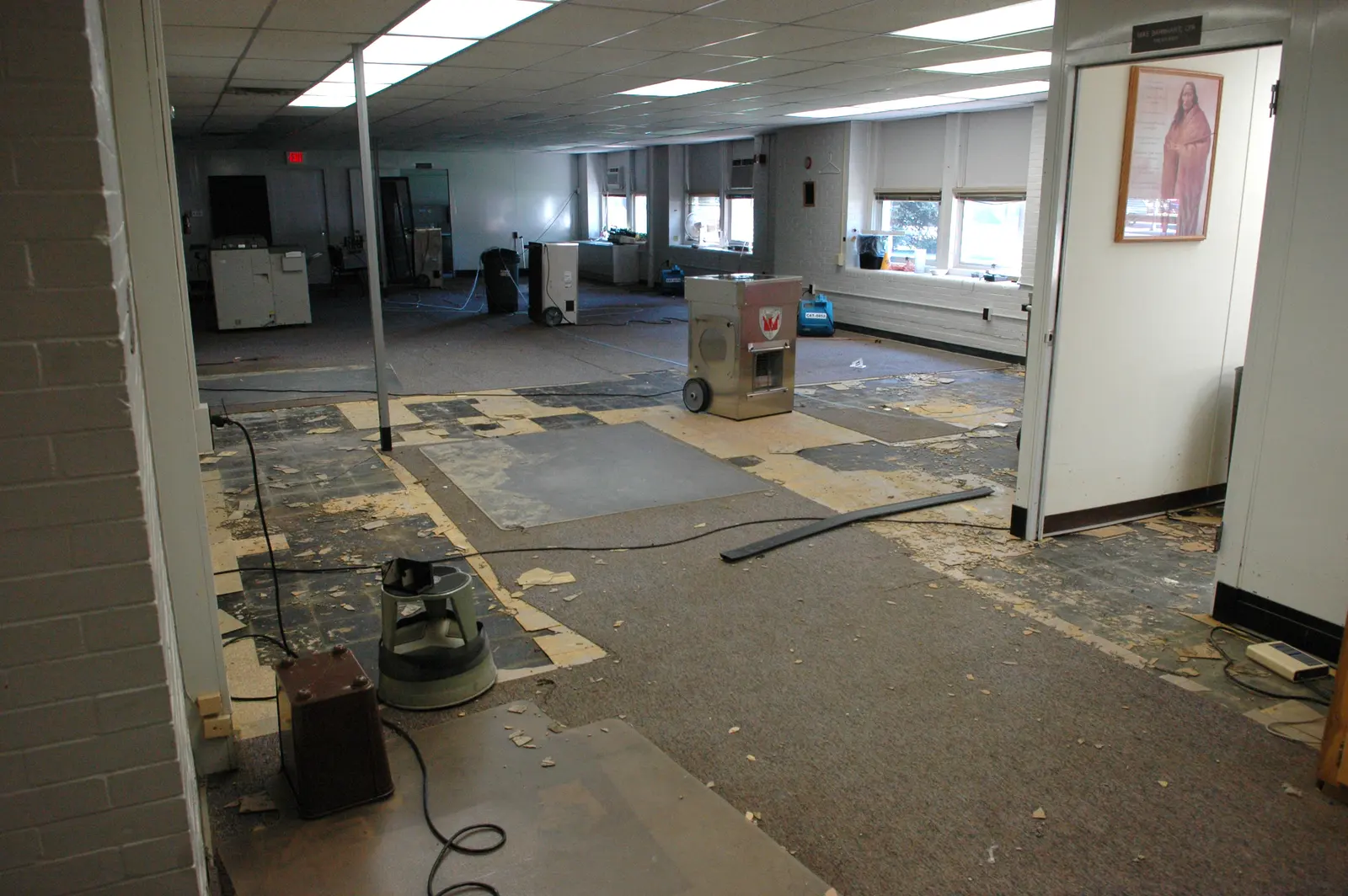 Dehumidifiers and air movers drying a water-damaged room. Shown on the Supply break page for Syracuse, NY.